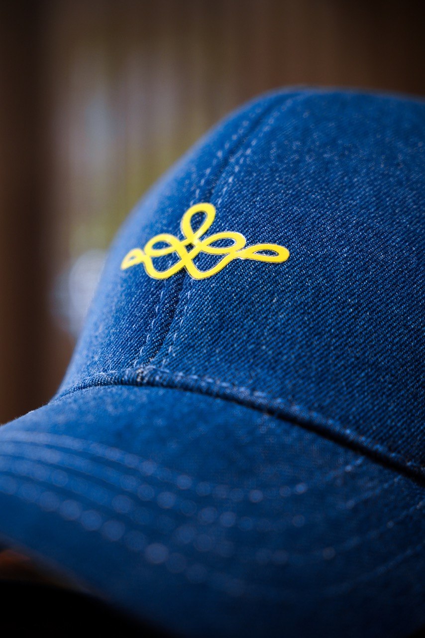 A denim cap with the mark embroidered