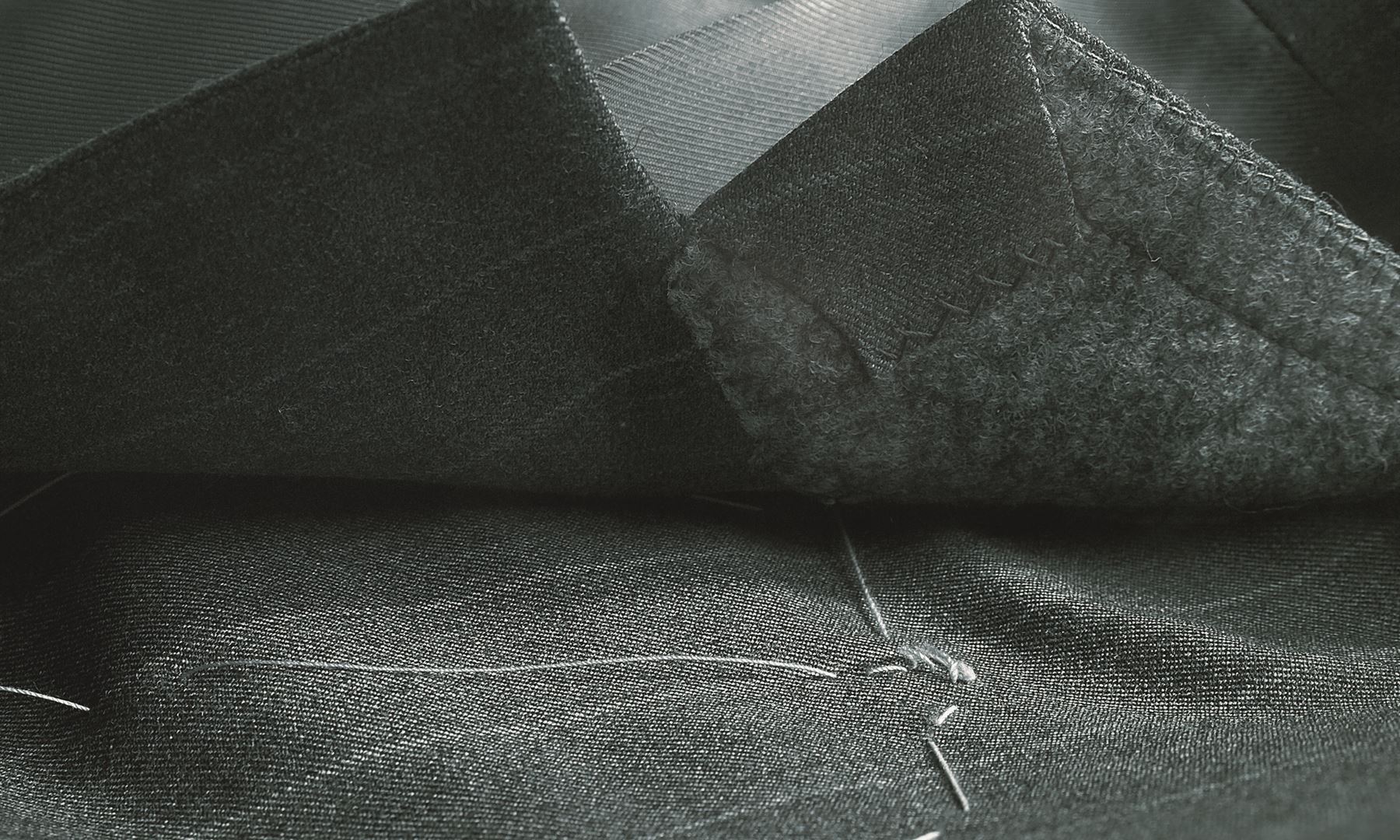 Charcoal worsted wool with basting thread
