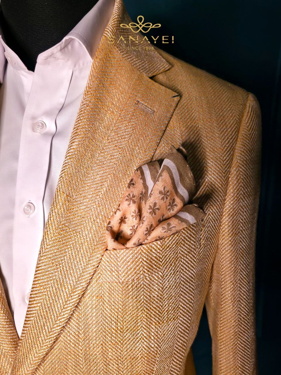 A herringbone jacket, with a silk pocket square